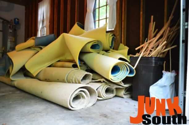 Pile of old carpet removal & disposal