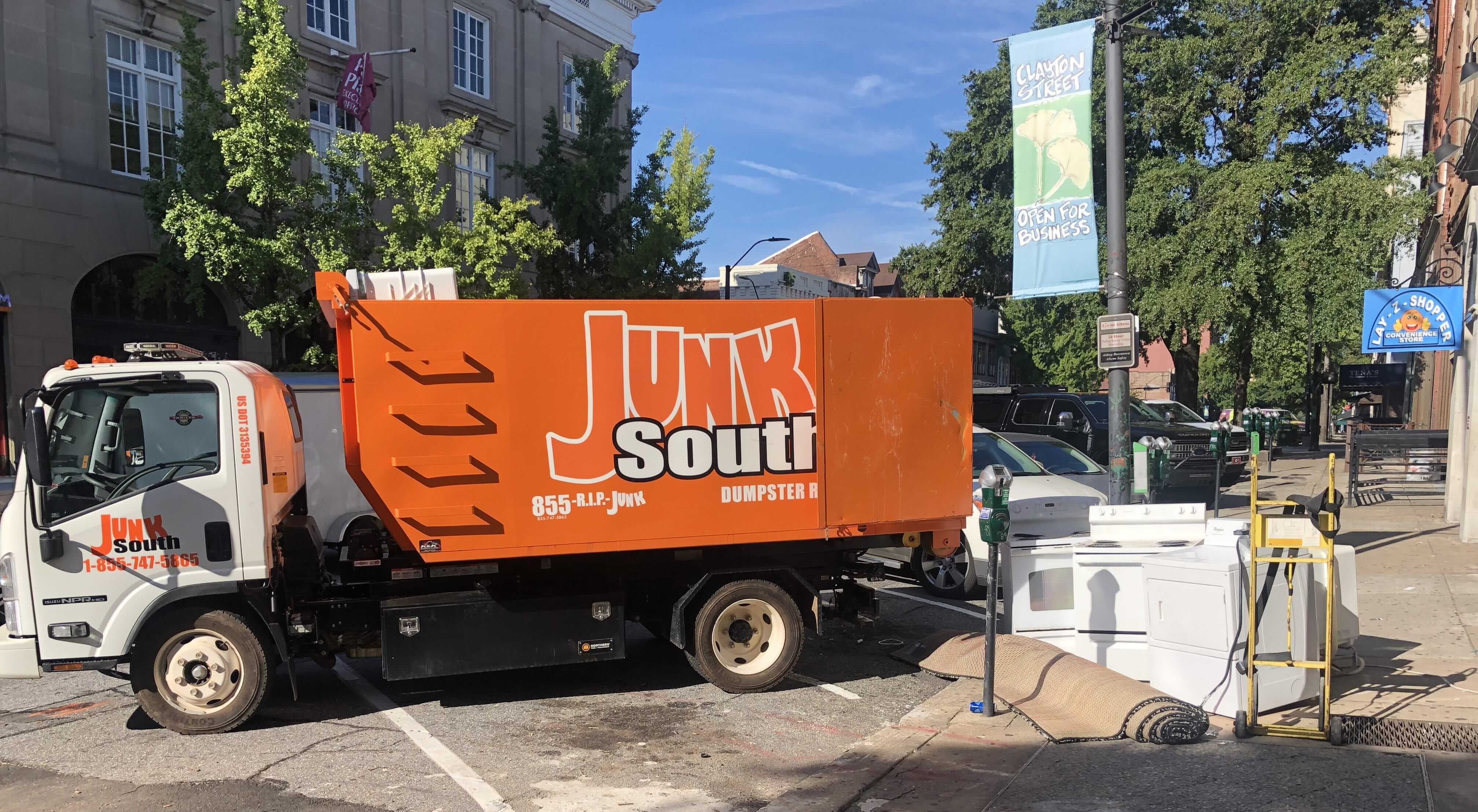 Junk South parked in Downtown Athens performing junk removal of old appliances