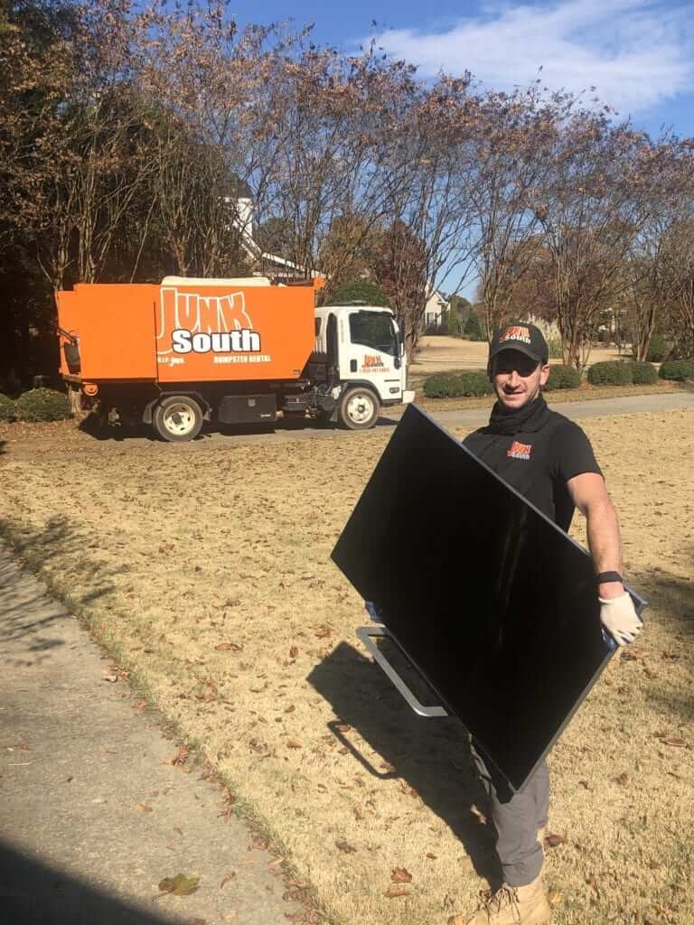 Junk South removes flatscreen tv from customer's home in Athens, GA